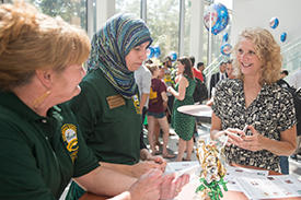 students and faculty socialize