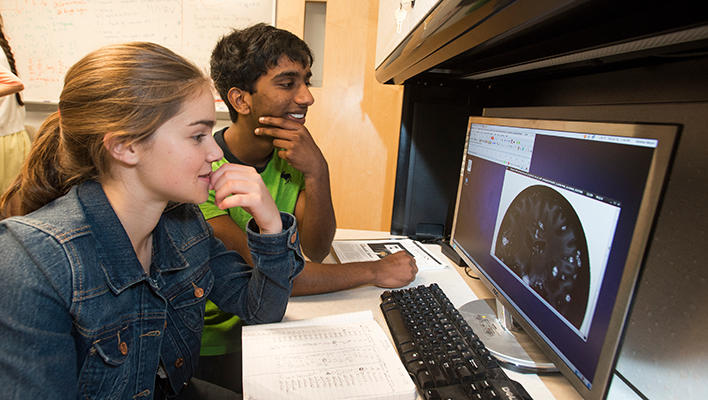 Students in the Aspiring Scientists Summer Internship Program (ASSIP) work in a lab at Fairfax campus.
